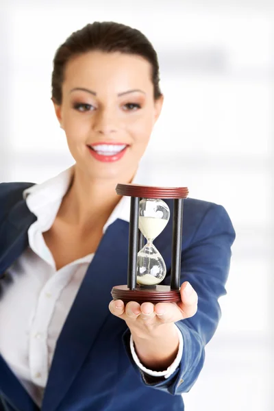 Business woman with hourglass — Stock Photo, Image