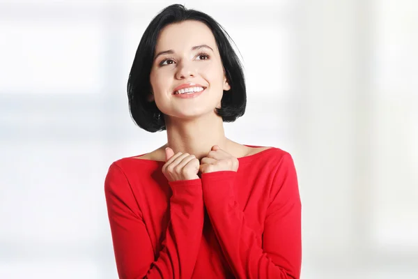 Mujer conmocionada y emocionada mirando hacia arriba — Foto de Stock