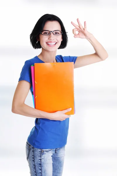 Retrato de uma bela jovem estudante gestos . — Fotografia de Stock