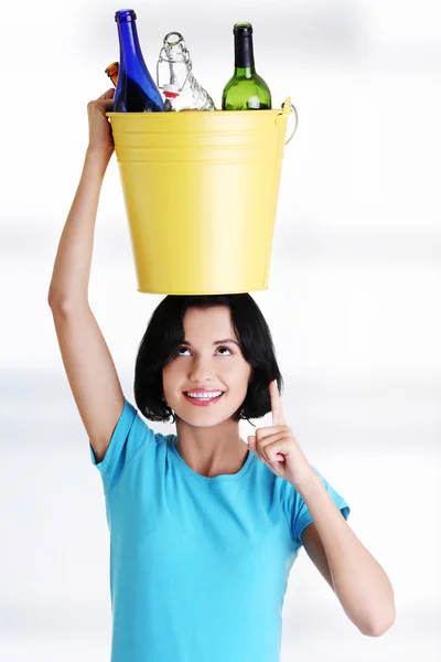 Beautiful young woman holding recycling bin — Stock Photo, Image