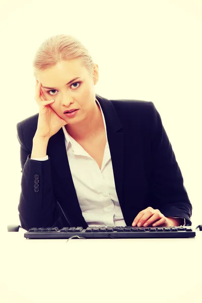 Bored businesswoman working — Stock Photo, Image