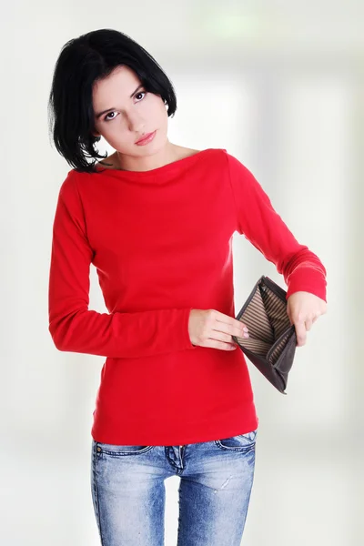 Young woman shows her empty wallet. Royalty Free Stock Photos