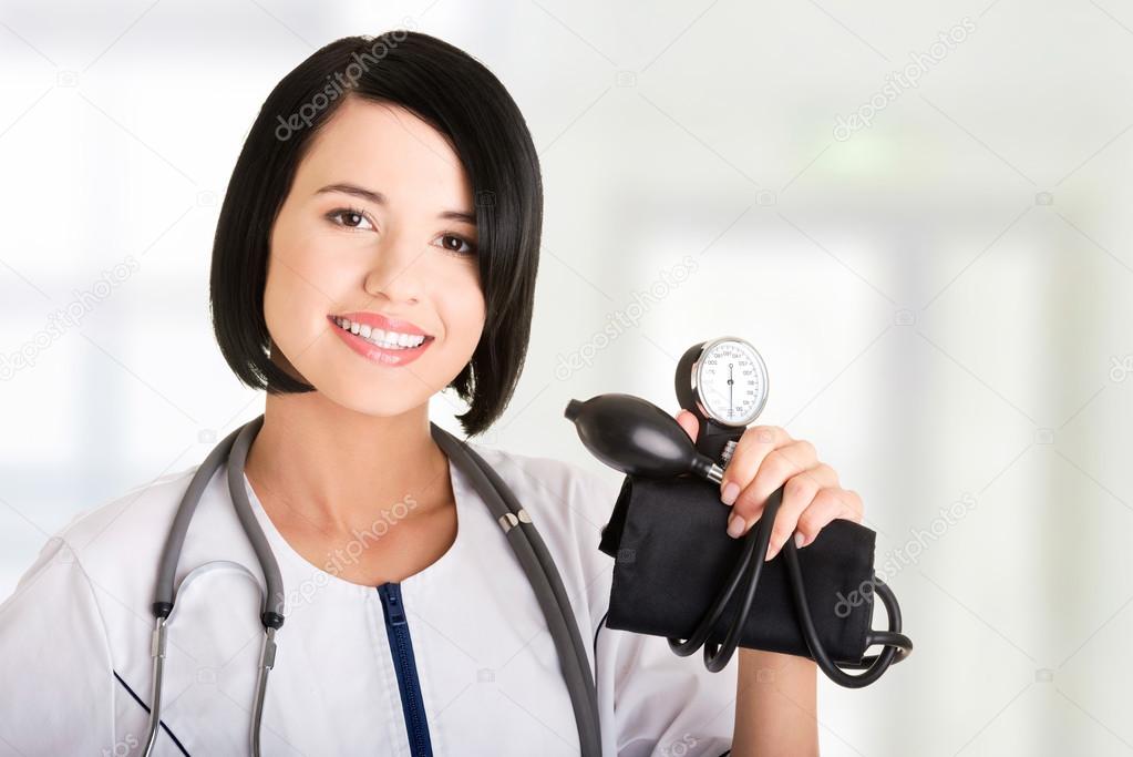 Woman doctor with pressure gauge