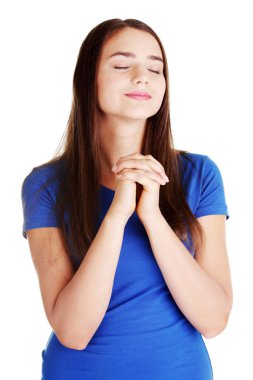 Genç güzel kadın dua ediyor..