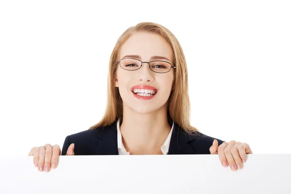Business woman holding empty board — Stock Photo, Image