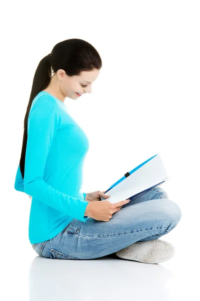 Beautiful young woman student with workbook. — Stock Photo, Image