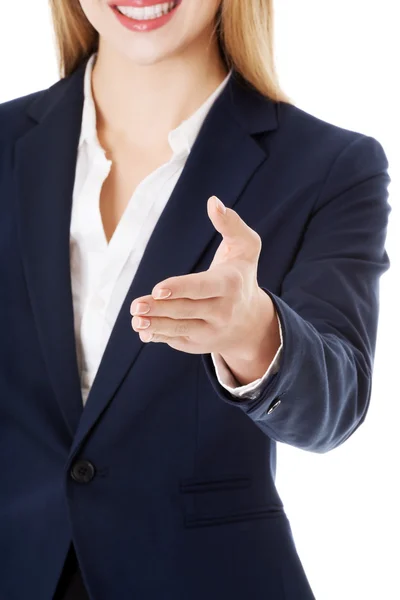 Beautiful business woman giving hand. — Stock Photo, Image