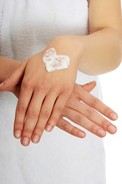 Woman with heart shape cream on hand. — Stock Photo, Image