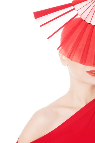 Beautiful sexy woman in red dress and fan. — Stock Photo, Image