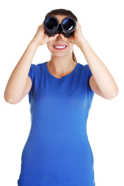 Beautiful young woman with binoculars. — Stock Photo, Image