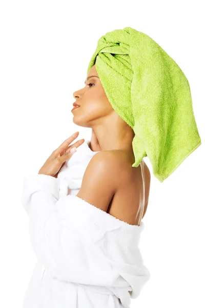 Attractive woman wrapped in towel with turban. — Stock Photo, Image