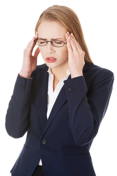 Beautiful business woman is having a headache. — Stock Photo, Image