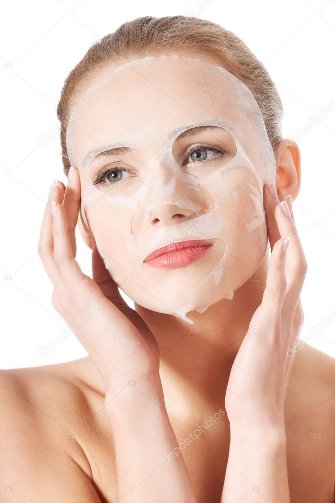 Beautiful young woman with collagen mask.