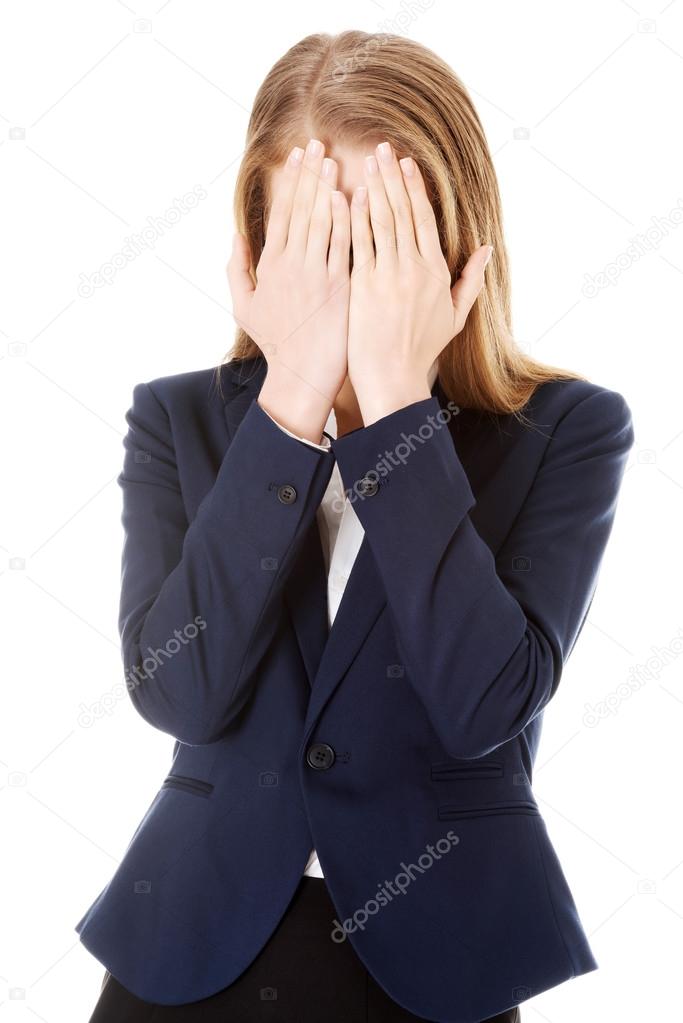 Beautiful business woman covering her face.