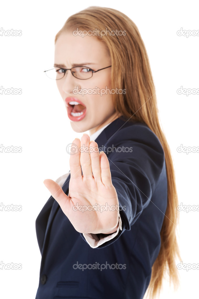 Business woman showing stop gesture by hand.