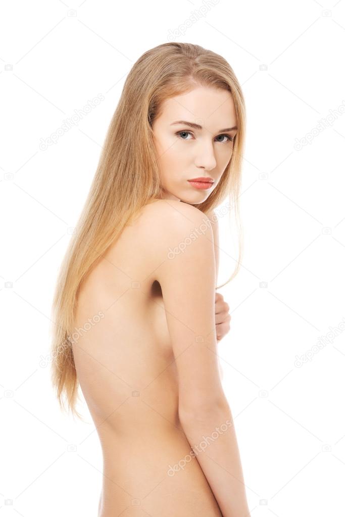 Side view naked woman touching her thigh. Side view naked woman touching her thigh.