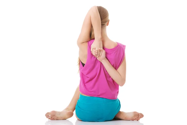 Beautiful caucasian woman is doing exercises. — Stock Photo, Image