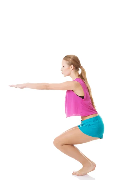 Young caucasian woman is doing exercises. — Stock Photo, Image