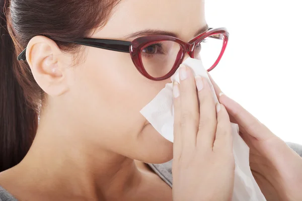 Young beautiful woman having runny nose, with tissue. — Stock Photo, Image
