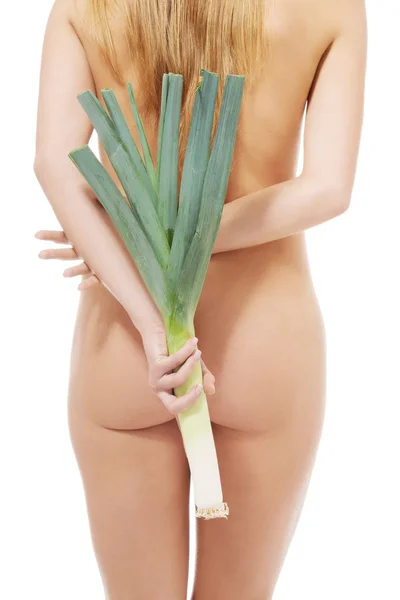 Naked woman holding leek. — Stock Photo, Image