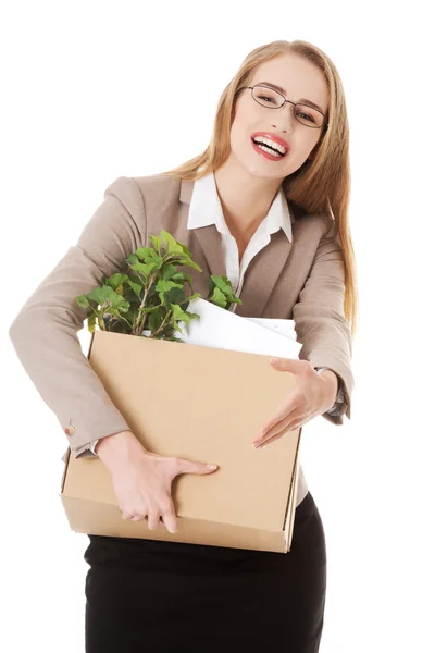 Business woman holding box with office items. — Stock Photo, Image