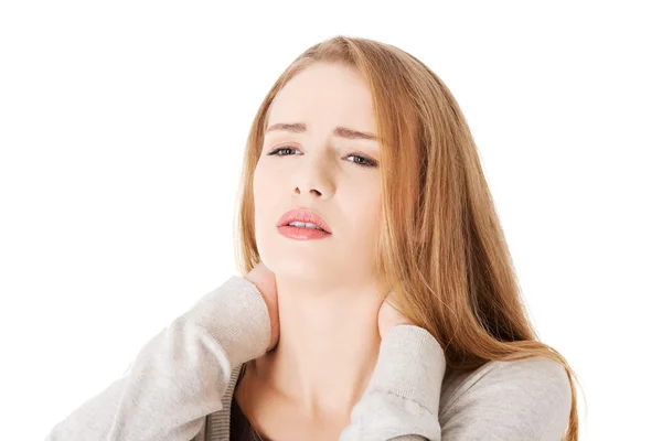 Woman is touching her neck. — Stock Photo, Image