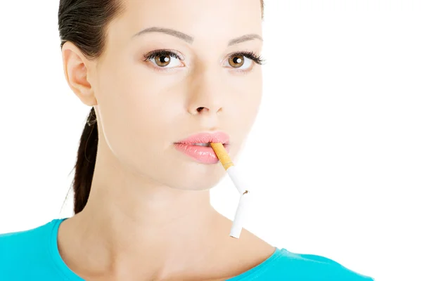 Young beautiful woman with broken cigarette. — Stock Photo, Image