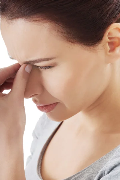 Beautiful young woman with sinus pressure. — Stock Photo, Image