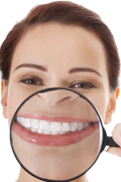 Woman with magnifying glass on mouth. — Stock Photo, Image