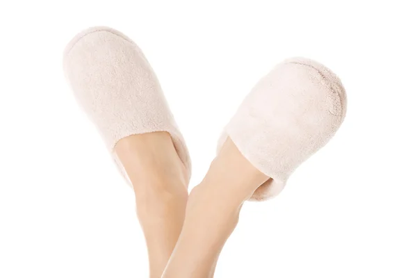 Female's feet with white slippers. — Stock Photo, Image