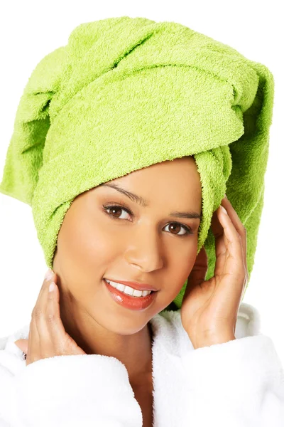 Woman wrapped in towel with turba — Stock Photo, Image