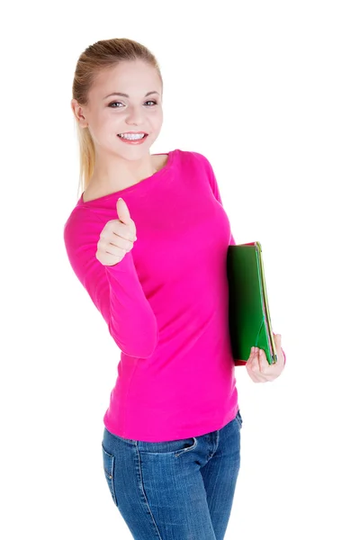 Young casual woman student showin OK gesture. — Stock Photo, Image