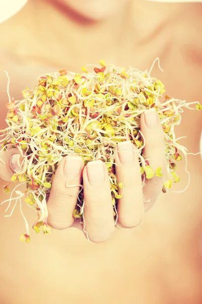 Woman with green cress. — Stock Photo, Image