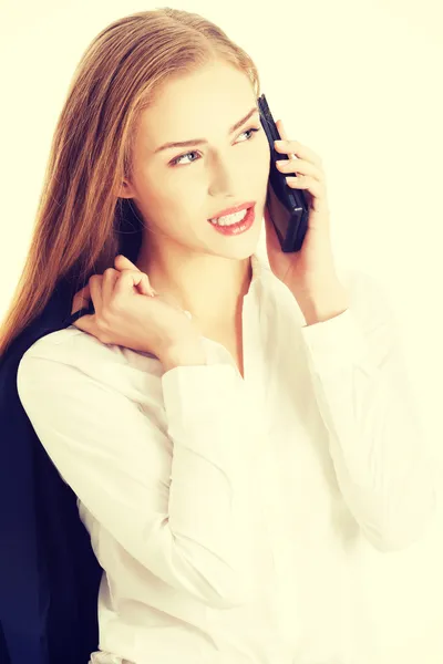 Mulher está falando através do telefone . — Fotografia de Stock