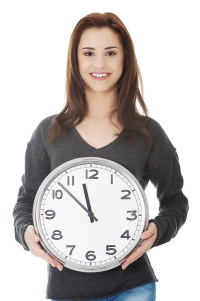 Happy woman holding office clock — Stock Photo, Image