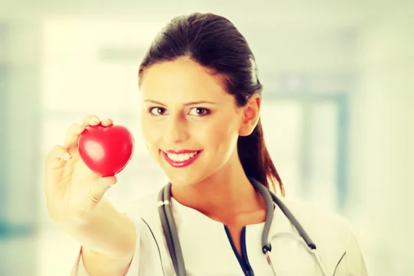 Young nurse with heart — Stock Photo, Image