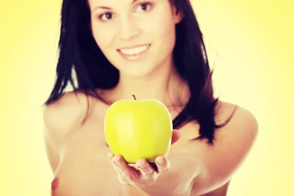 Girl with a green juicy apple — Stock Photo, Image