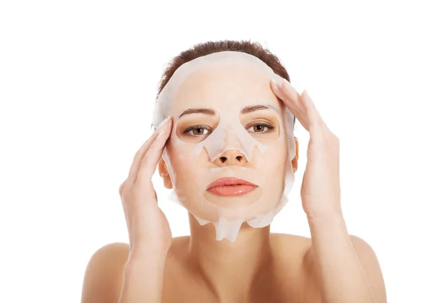 Beautiful woman with collagen mask. — Stock Photo, Image