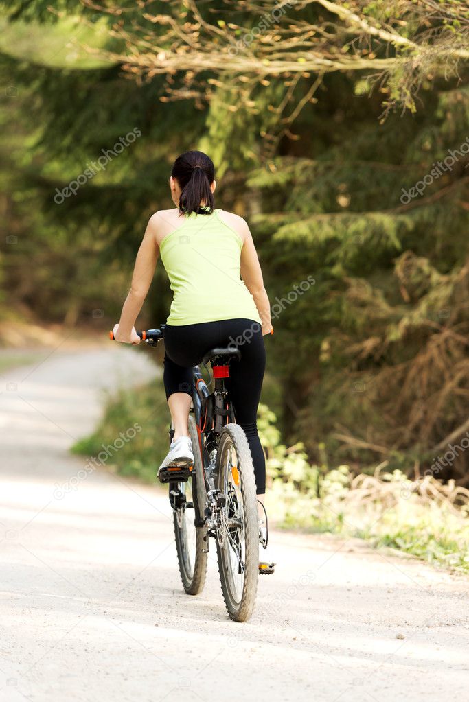 Female tourist with bicycle
