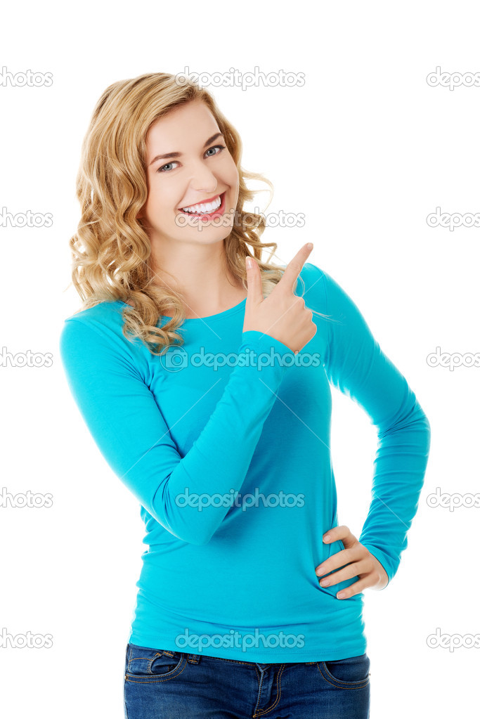 Woman pointing on copy space.