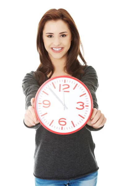 Woman holding office clock Stock Photo