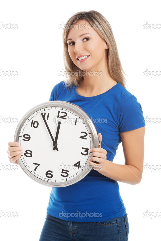 Happy woman holding office clock