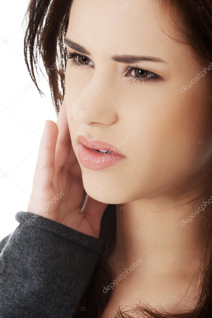 Teen woman having a terrible tooth ache.