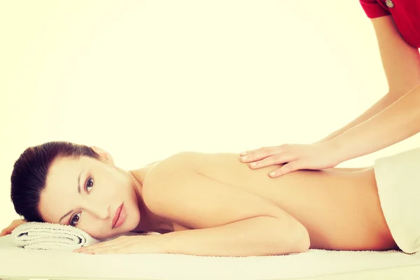 Preaty woman relaxing beeing massaged in spa — Stock Photo, Image