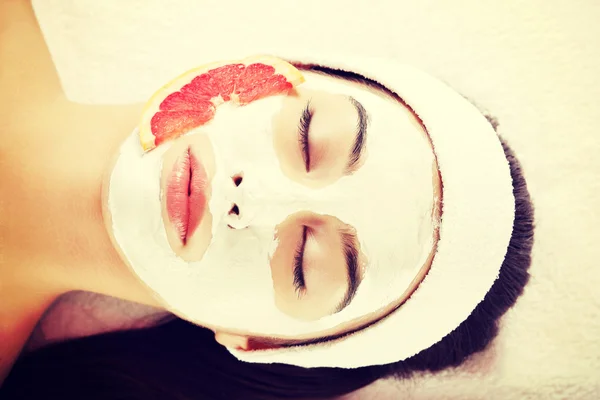 Attractive young woman with fruit mask — Stock Photo, Image