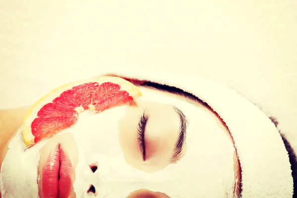 Attractive young woman with fruit mask — Stock Photo, Image