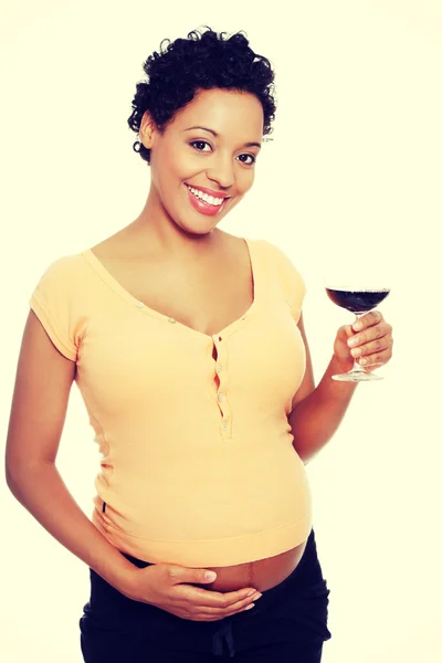 Pregnant woman holding glass wine — Stock Photo, Image
