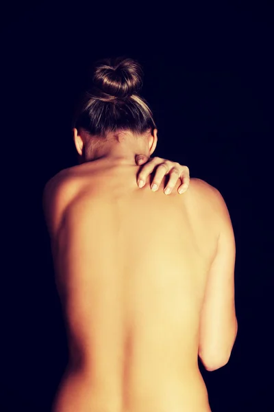 Молода жінка з болем у спині . — стокове фото
