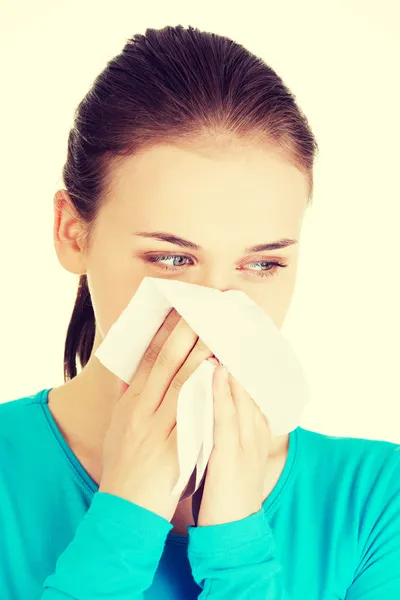 Young woman with tissue - sneezing. — Stock Photo, Image