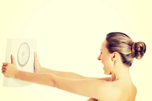 Nude topless woman holding scale. — Stock Photo, Image
